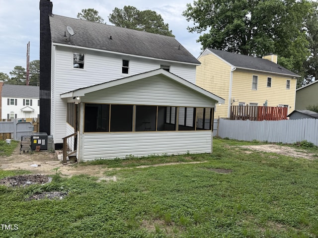 3825 Old Coach Rd, Raleigh, NC 27616 - back of house with a sunroom and a chimney