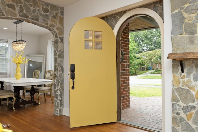 106 E Club Blvd, Durham, NC 27704 - entryway with arched walkways, plenty of natural light, wood finished floors, and a chandelier