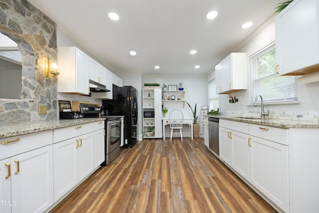106 E Club Blvd, Durham, NC 27704 - kitchen with appliances with stainless steel finishes, ornamental molding, under cabinet range hood, a sink, and white cabinets