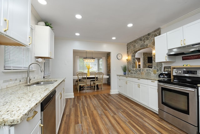 106 E Club Blvd, Durham, NC 27704 - kitchen with appliances with stainless steel finishes, a sink, under cabinet range hood, crown molding, and white cabinets