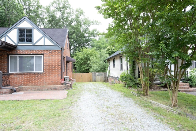 106 E Club Blvd, Durham, NC 27704 - view of property exterior with driveway and brick siding