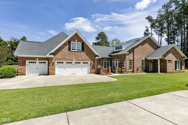 3628 Eagle Farm Dr N, Wilson, NC 27896 - view of front of property featuring brick siding, concrete driveway, a shingled roof, and a front yard