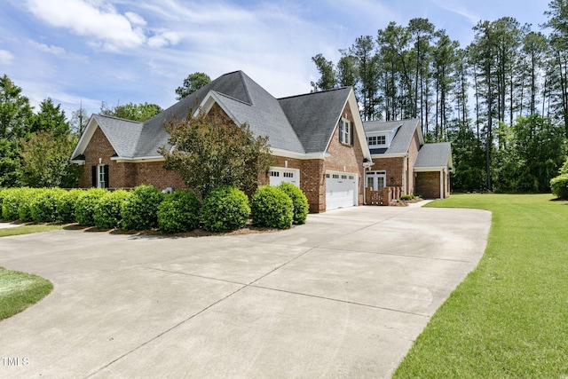 3628 Eagle Farm Dr N, Wilson, NC 27896 - view of side of property with brick siding, concrete driveway, a yard, and a shingled roof