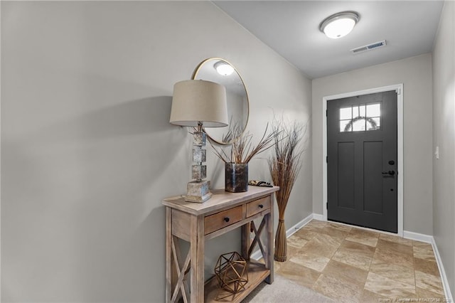 308 Hazel Dr, Stantonsburg, NC 27883 - foyer with baseboards and stone finish floors