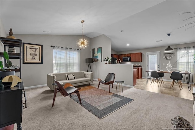 308 Hazel Dr, Stantonsburg, NC 27883 - living room featuring a chandelier, vaulted ceiling, baseboards, and light carpet