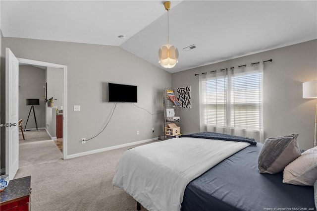 308 Hazel Dr, Stantonsburg, NC 27883 - bedroom featuring vaulted ceiling, light carpet, and baseboards