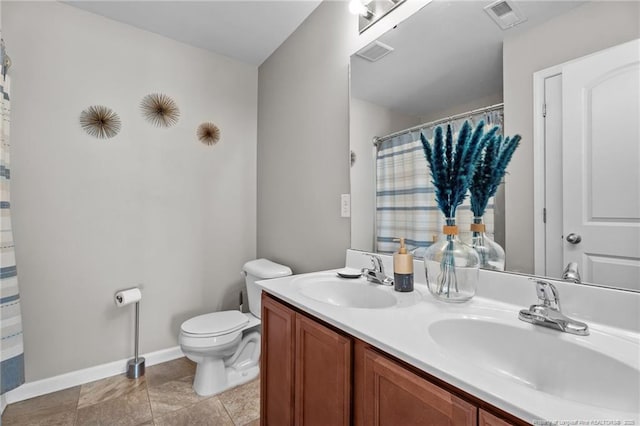 308 Hazel Dr, Stantonsburg, NC 27883 - bathroom featuring double vanity, toilet, baseboards, and curtained shower