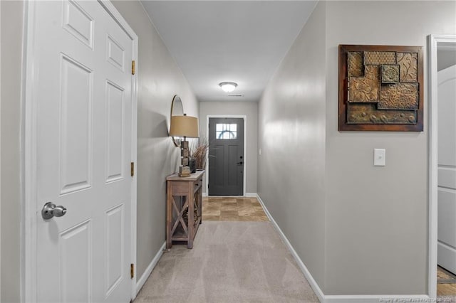 308 Hazel Dr, Stantonsburg, NC 27883 - doorway with baseboards and light carpet