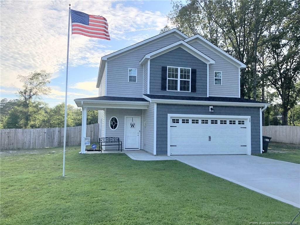 164 Merita Dr, Raeford, NC 28376 - view of front of house with a garage, covered porch, and driveway