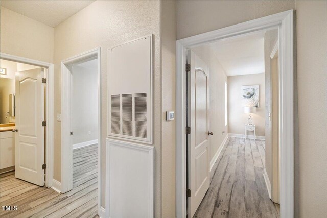1912 Parkside Village Dr, Clayton, NC 27520 - hallway with light wood-style flooring and baseboards