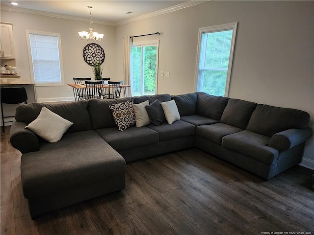 207 Southwick Ct, Sanford, NC 27332 - living room with dark wood finished floors, a chandelier, ornamental molding, and baseboards