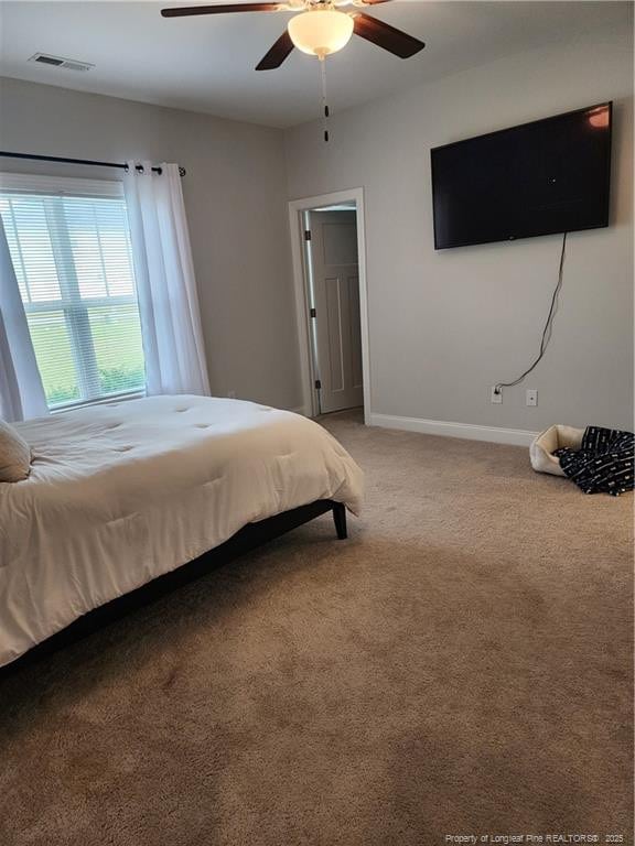 207 Southwick Ct, Sanford, NC 27332 - bedroom featuring light colored carpet, baseboards, and ceiling fan