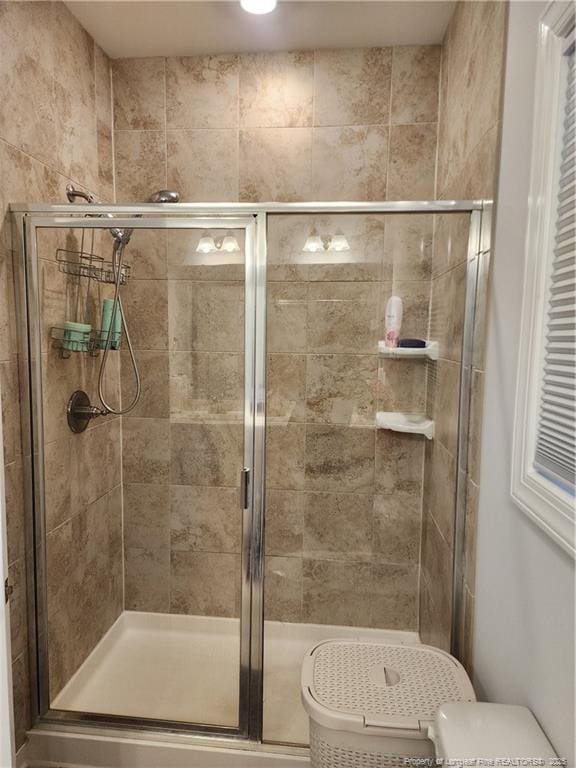 207 Southwick Ct, Sanford, NC 27332 - full bathroom featuring a stall shower and toilet