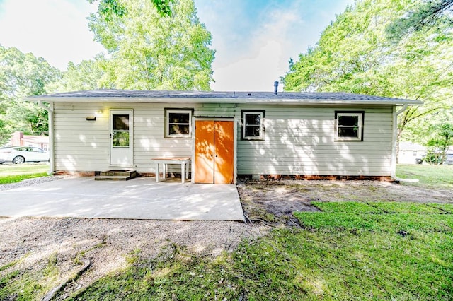 2327 Dewitt St, Sanford, NC 27330 - back of property featuring entry steps, a patio, and a lawn
