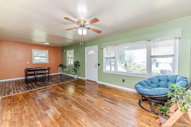 2327 Dewitt St, Sanford, NC 27330 - living area featuring wood finished floors, ceiling fan, and baseboards