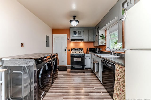 2327 Dewitt St, Sanford, NC 27330 - kitchen featuring freestanding refrigerator, range with gas cooktop, dishwasher, a sink, and washer and clothes dryer