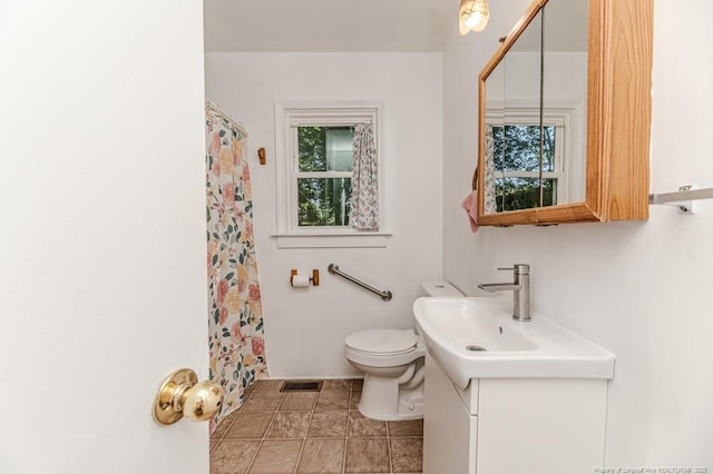 2327 Dewitt St, Sanford, NC 27330 - bathroom with vanity, toilet, and curtained shower