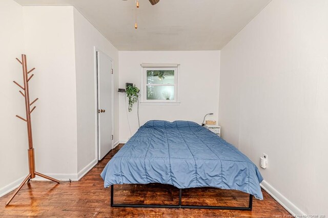 2327 Dewitt St, Sanford, NC 27330 - bedroom with wood finished floors, baseboards, and a ceiling fan