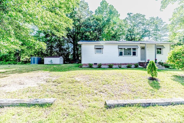 2327 Dewitt St, Sanford, NC 27330 - single story home with a front lawn and view of wooded area