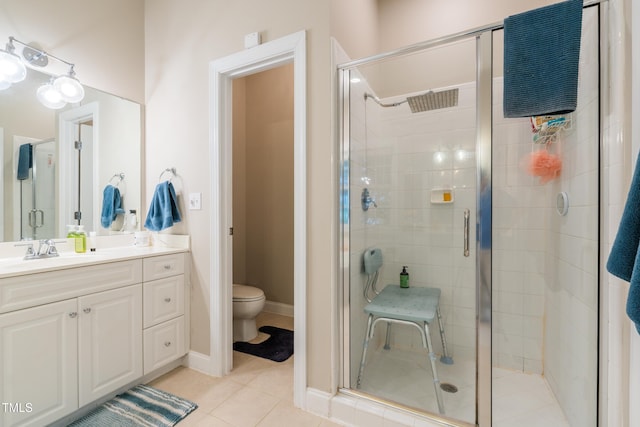116 Hamilton Hedge Pl, Cary, NC 27519 - full bathroom with vanity, a stall shower, toilet, and tile patterned flooring