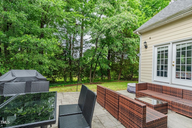 116 Hamilton Hedge Pl, Cary, NC 27519 - view of patio with outdoor lounge area, view of wooded area, and french doors
