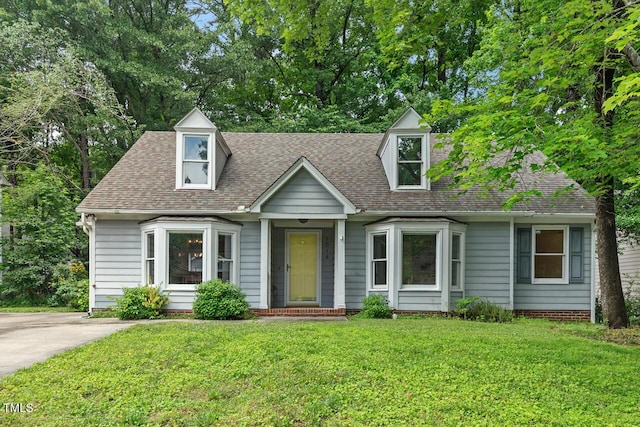 1014 Laurens Way, Knightdale, NC 27545 - cape cod house featuring a front lawn and roof with shingles