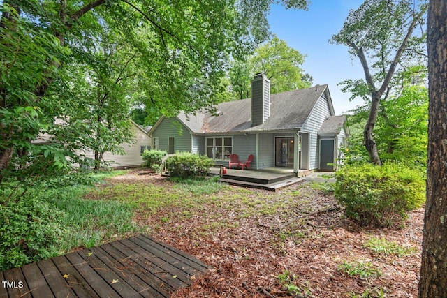 1014 Laurens Way, Knightdale, NC 27545 - back of house with a wooden deck, a chimney, and a shingled roof