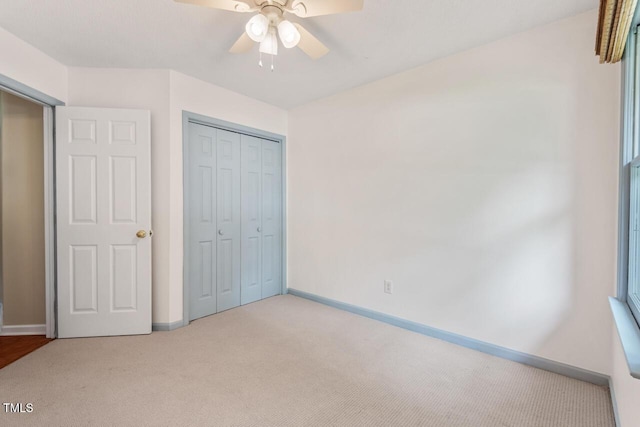1014 Laurens Way, Knightdale, NC 27545 - unfurnished bedroom featuring carpet flooring, baseboards, a closet, and ceiling fan
