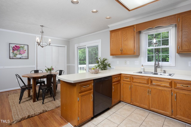657 Lakeview Dr, Stem, NC 27581 - kitchen featuring dishwasher, a sink, brown cabinetry, light countertops, and ornamental molding