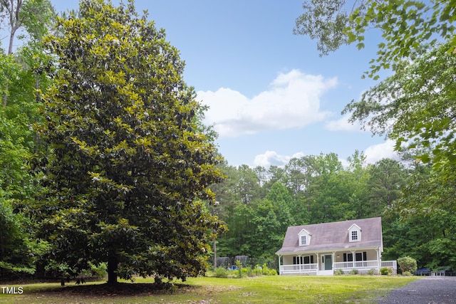 657 Lakeview Dr, Stem, NC 27581 - view of front facade with covered porch and a front yard