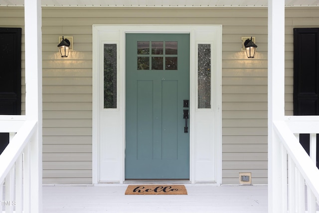 657 Lakeview Dr, Stem, NC 27581 - doorway to property featuring a porch and metal roof