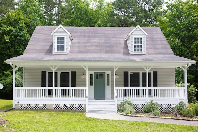 657 Lakeview Dr, Stem, NC 27581 - farmhouse featuring a porch, a front yard, and view of scattered trees
