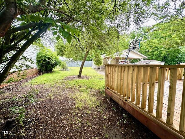 3810 Pendergrass St, Durham, NC 27704 - view of yard featuring a wooden deck