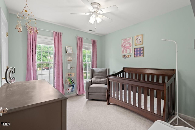 5 Providence Ridge Ln, Durham, NC 27713 - carpeted bedroom featuring a crib and a ceiling fan