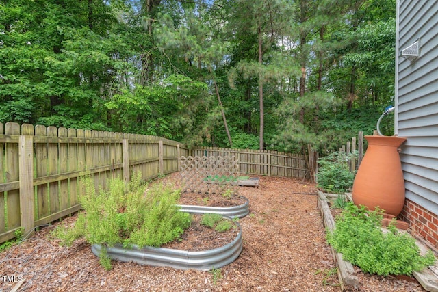 5 Providence Ridge Ln, Durham, NC 27713 - fenced backyard with a vegetable garden