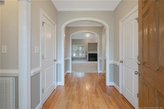 45 Remington Hills Dr, Bunnlevel, NC 28323 - corridor with light wood-style flooring, arched walkways, baseboards, and ornamental molding