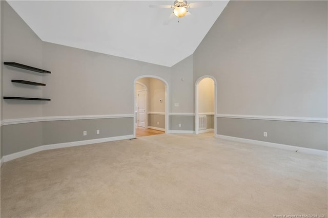 45 Remington Hills Dr, Bunnlevel, NC 28323 - empty room with arched walkways, a ceiling fan, carpet, high vaulted ceiling, and baseboards