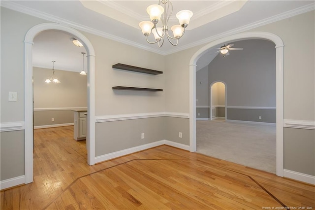 45 Remington Hills Dr, Bunnlevel, NC 28323 - spare room with arched walkways, a chandelier, light wood-type flooring, ceiling fan, and crown molding