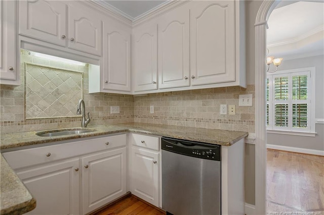 45 Remington Hills Dr, Bunnlevel, NC 28323 - kitchen featuring stainless steel dishwasher, a sink, wood finished floors, white cabinets, and crown molding