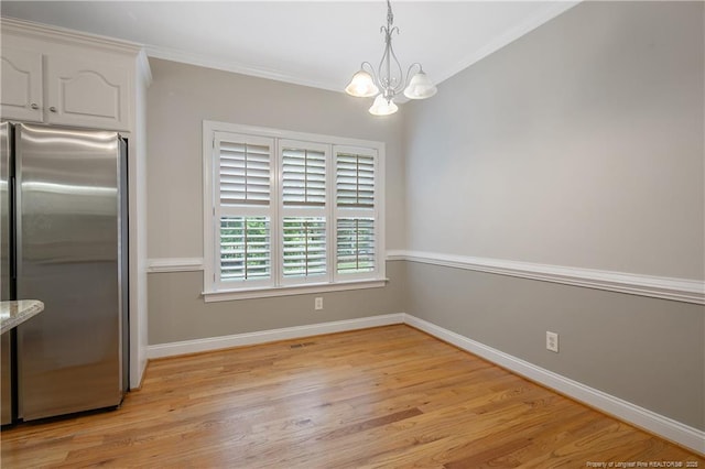 45 Remington Hills Dr, Bunnlevel, NC 28323 - unfurnished dining area featuring a chandelier, light wood-style floors, ornamental molding, and baseboards