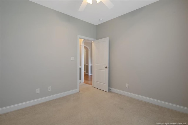 45 Remington Hills Dr, Bunnlevel, NC 28323 - empty room with light carpet, baseboards, a ceiling fan, and arched walkways
