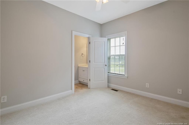 45 Remington Hills Dr, Bunnlevel, NC 28323 - empty room featuring a ceiling fan, light colored carpet, and baseboards