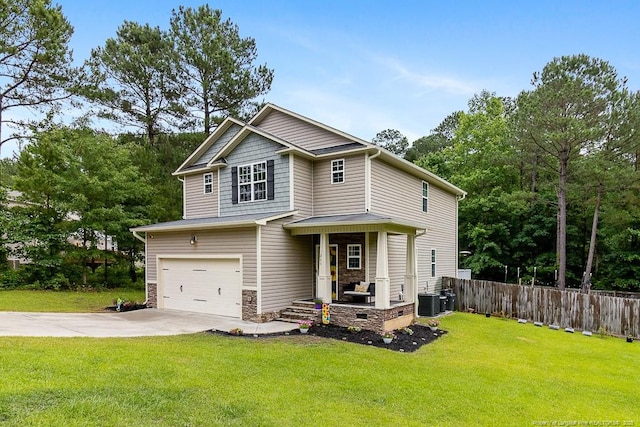 265 Tactical Dr, Bunnlevel, NC 28323 - craftsman house featuring an attached garage, concrete driveway, and central AC unit