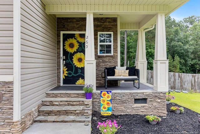 265 Tactical Dr, Bunnlevel, NC 28323 - property entrance with covered porch and stone siding