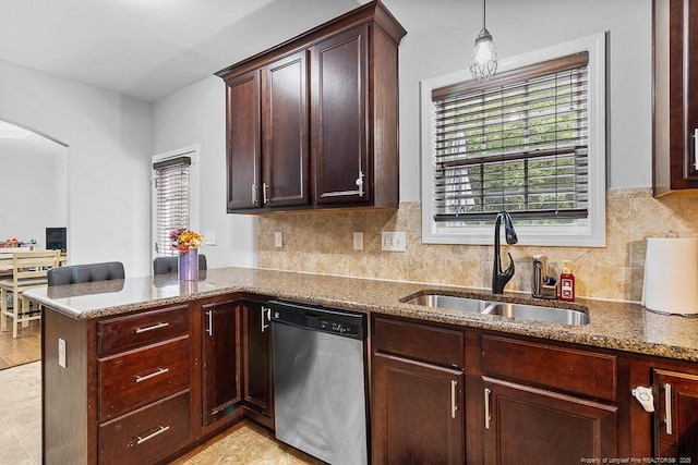 265 Tactical Dr, Bunnlevel, NC 28323 - kitchen featuring dishwasher, a sink, a peninsula, and stone counters