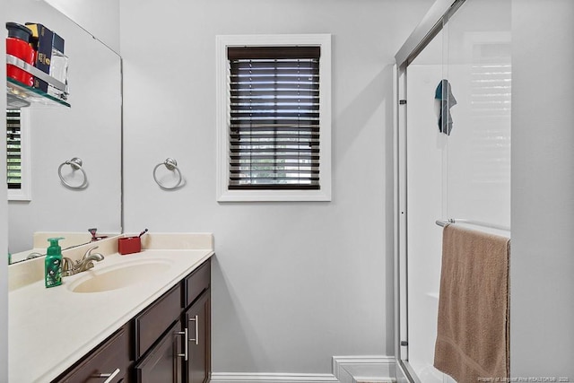 265 Tactical Dr, Bunnlevel, NC 28323 - bathroom with vanity, a stall shower, and plenty of natural light