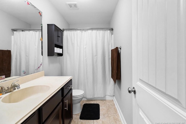 265 Tactical Dr, Bunnlevel, NC 28323 - full bath featuring vanity, toilet, tile patterned floors, a shower with shower curtain, and baseboards