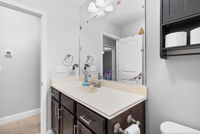 265 Tactical Dr, Bunnlevel, NC 28323 - half bathroom featuring vanity, baseboards, and toilet