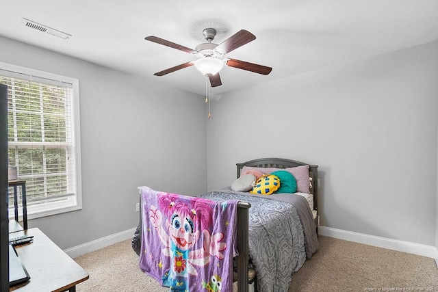 265 Tactical Dr, Bunnlevel, NC 28323 - carpeted bedroom featuring baseboards and a ceiling fan