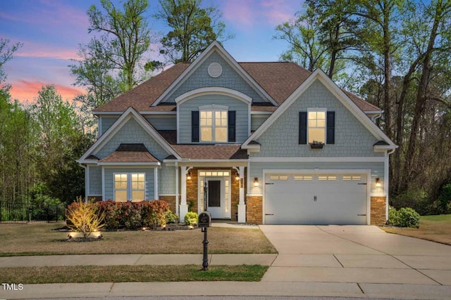 347 Country Mill Way, Fuquay Varina, NC 27526 - view of front of property with an attached garage, driveway, a shingled roof, and stone siding